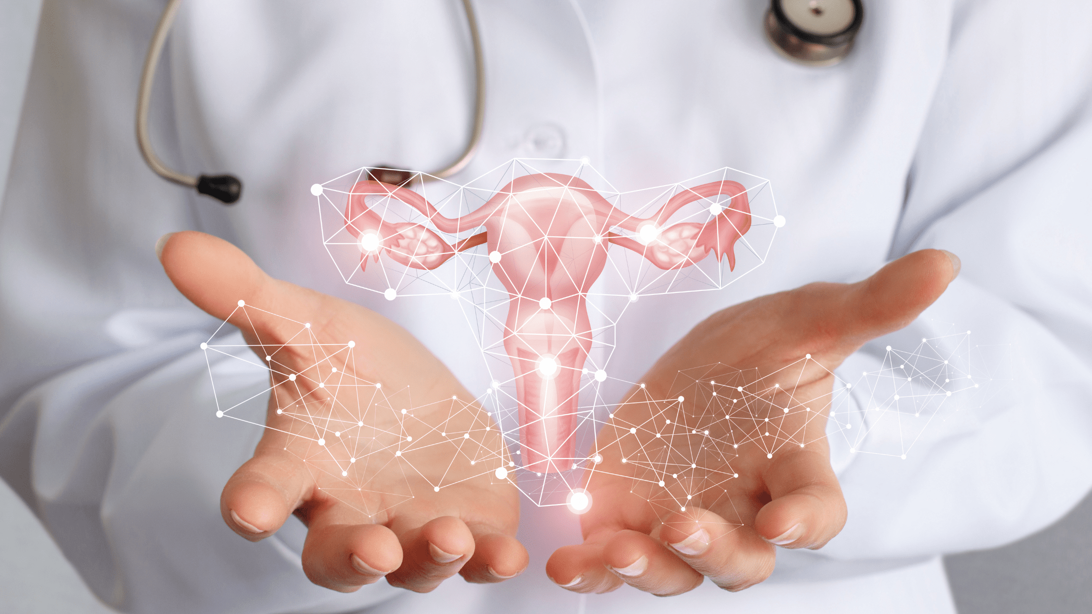 An OB/Gyn resident holding a floating representation of a uterus.