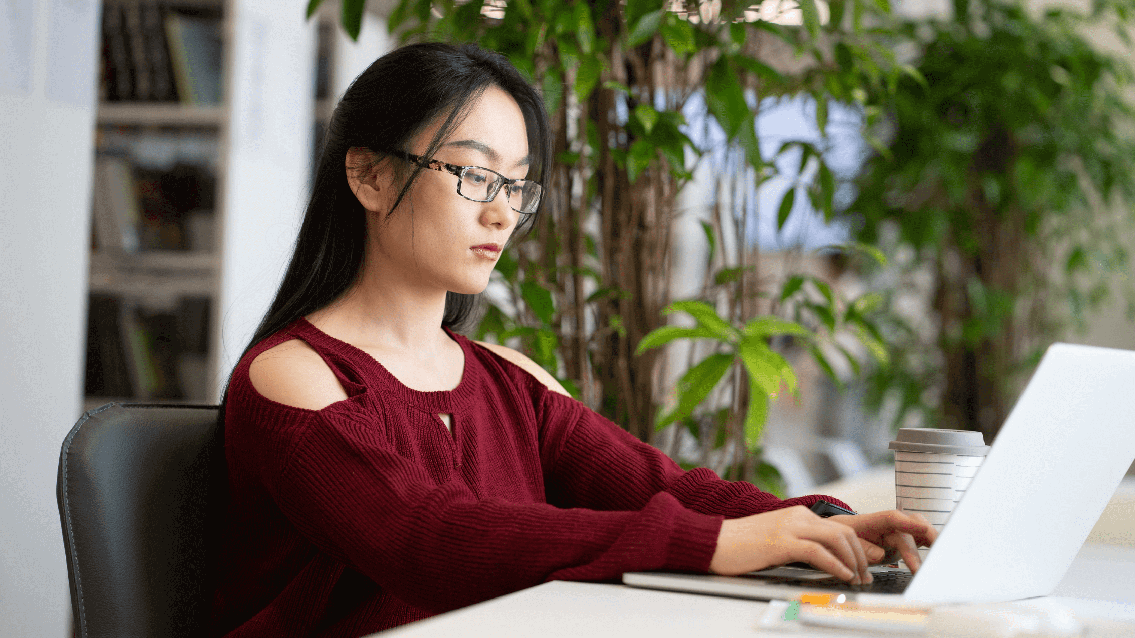 A DO med school student studying for her COMLEX Level 2 and Step 2 simultaneously, sitting in front of a laptop.