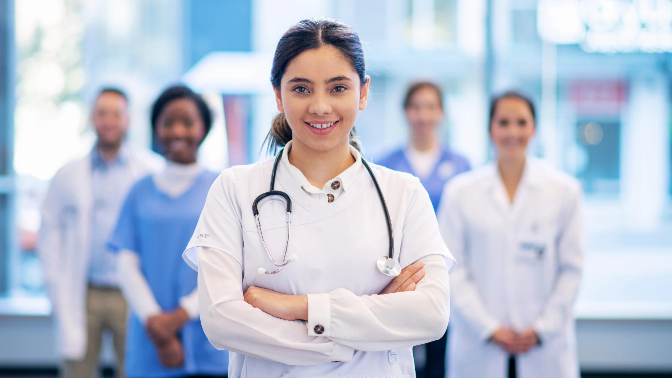 Young doctor in a white coat with stethoscope, ready to excel in a family medicine rotation.